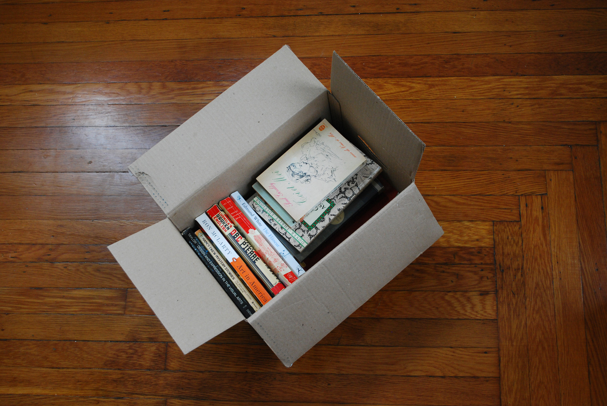 Books packed in a moving box