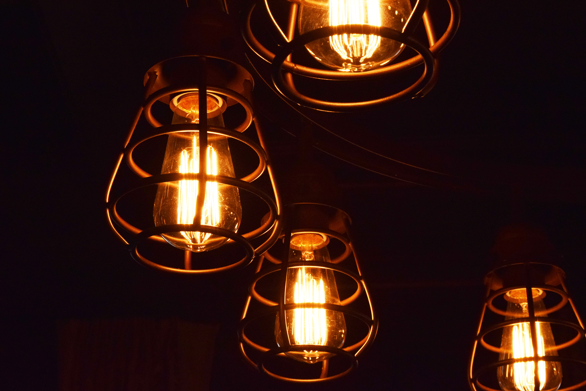 Four cage lights in a dark room | House-Selling Tips