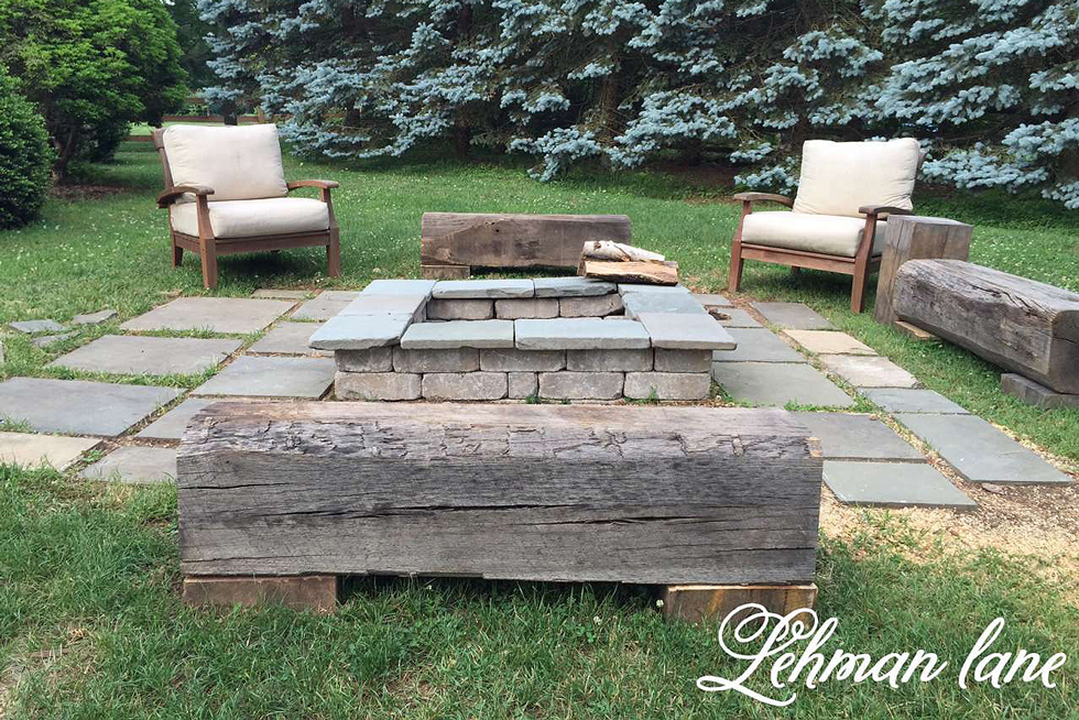 A gray paver patio with fire pit