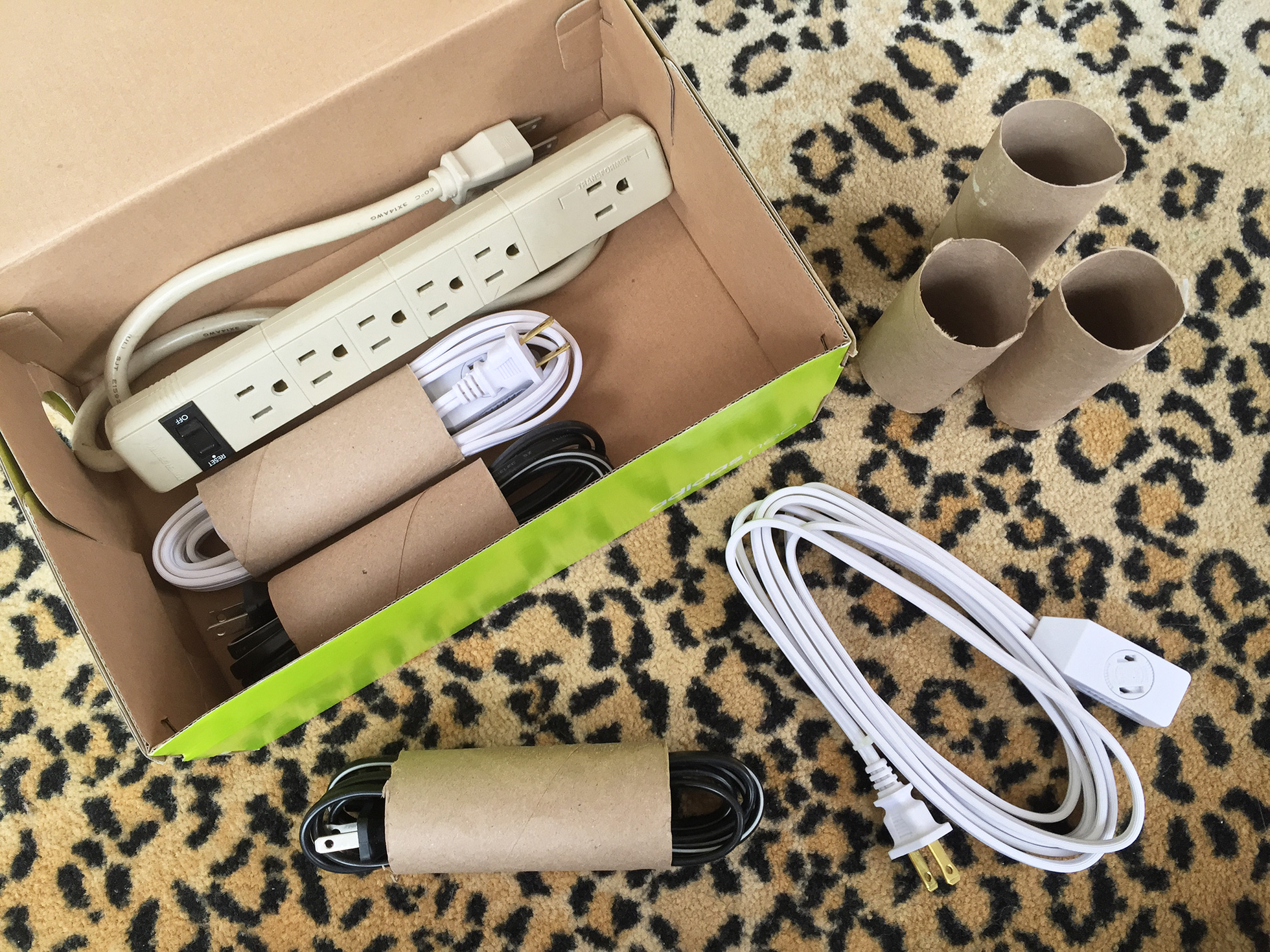 Organize power cords when moving by using toilet paper rolls