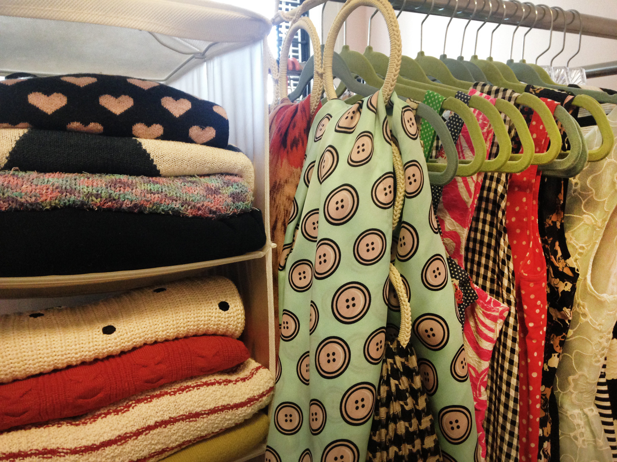 Clothes organized in a closet